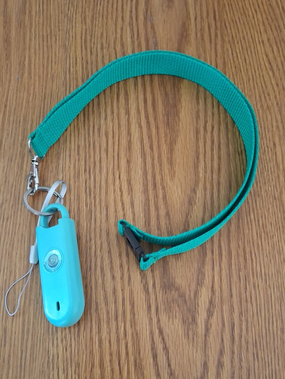 Turquoise Personal Safety Alarm with Green Lanyard